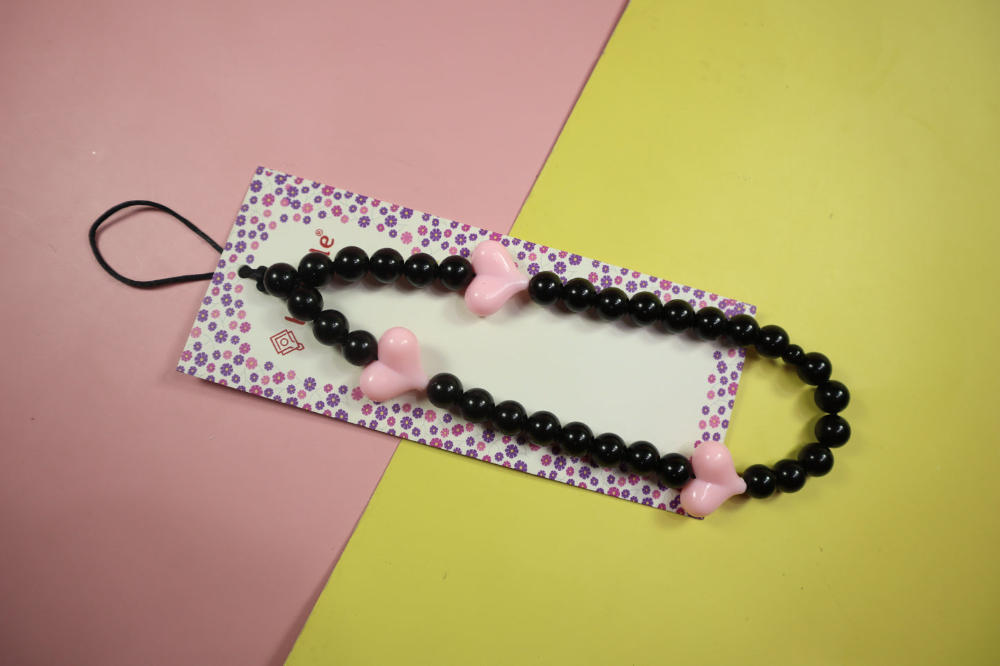 Blush Noir black with the softness of pink phone charm