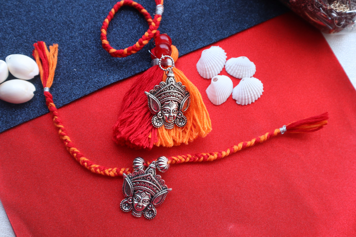 Kamule Durga Idol Rakhi Bhaiya Bhabhi Rakhi Set of 2 - Red & Orange