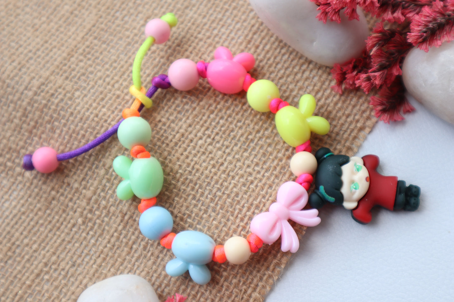 Kamule Acrylic Beaded Doll Charm Rakhi- Black and Maroon