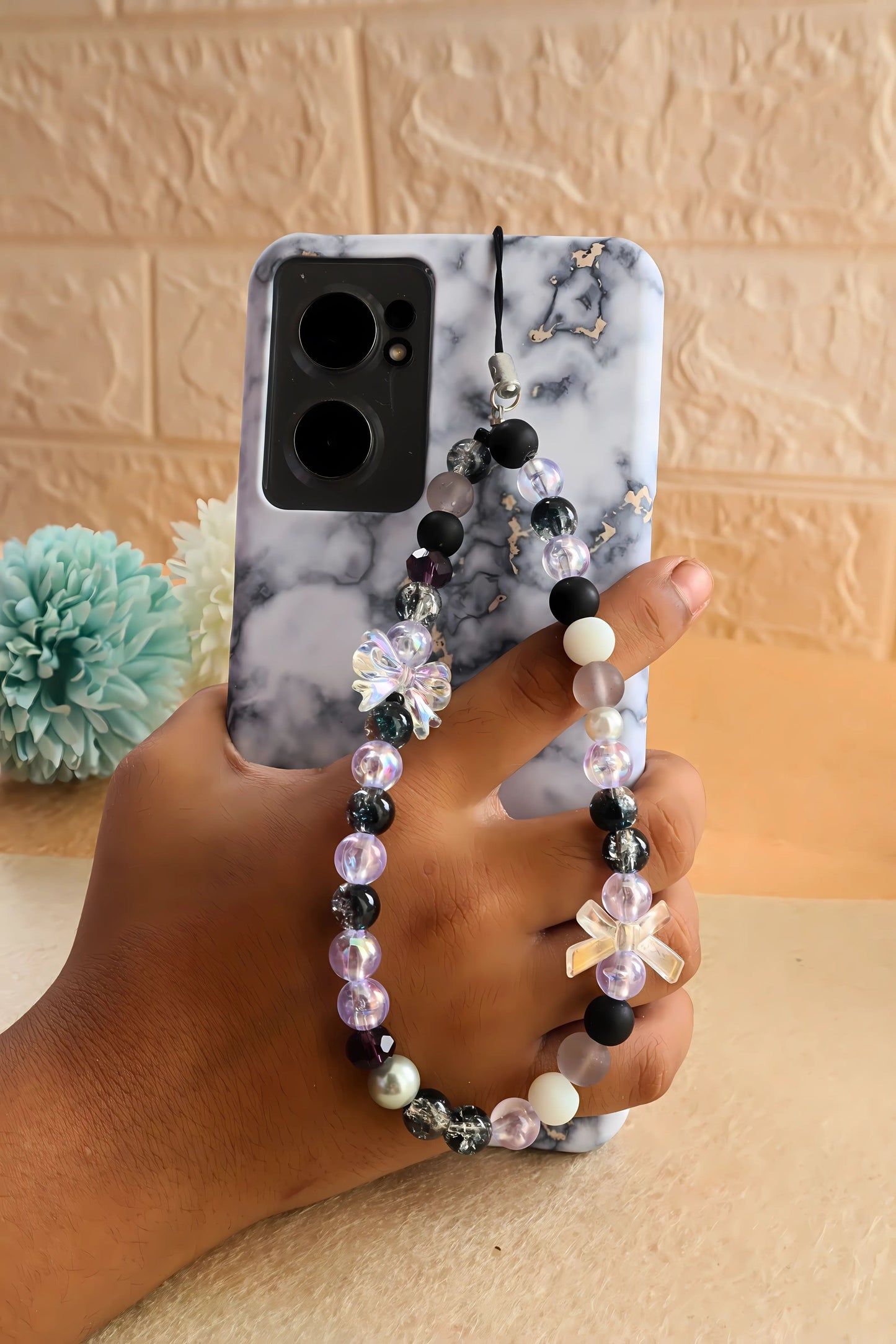 Kamule Glossy black, matte grey, and shimmering pearl beads phone charm