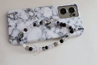 Kamule Glossy black, matte grey, and shimmering pearl beads phone charm