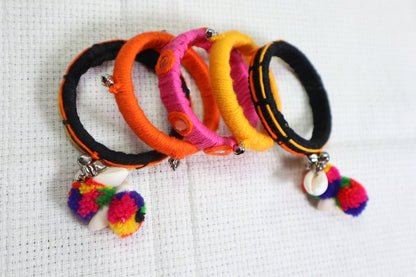 Kamule Navratri-Inspired Set of 5 Wool Thread Bangles with Shell & Pom-Pom Charms – Multicolour