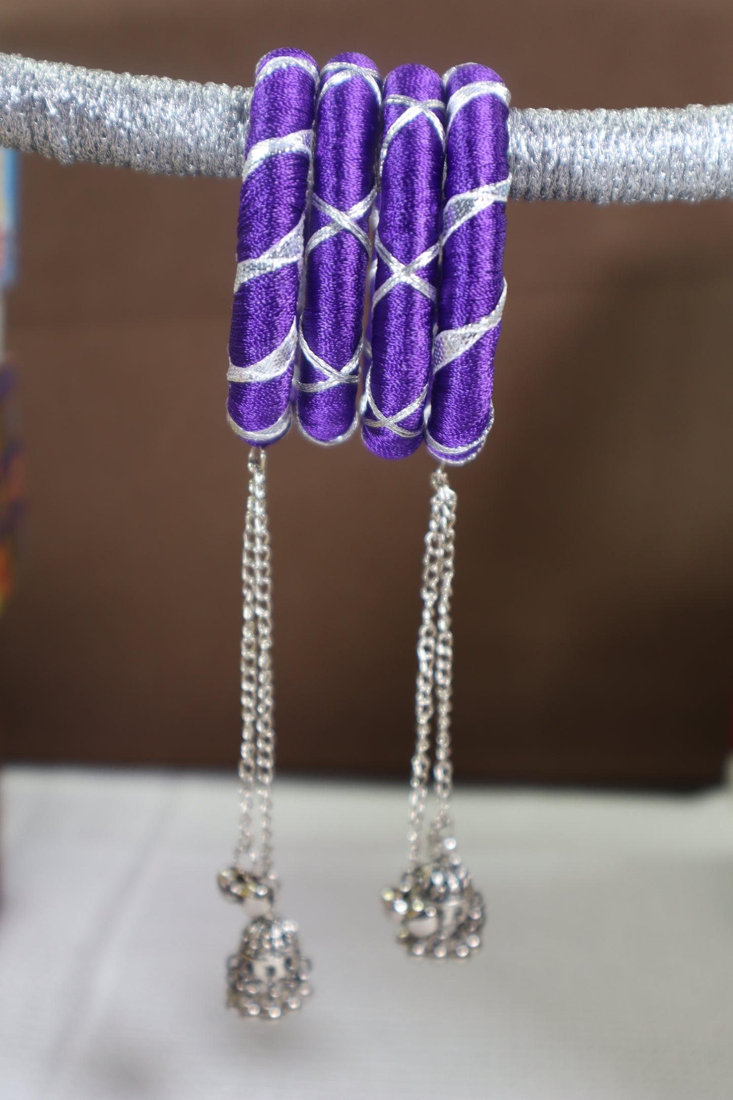 Kamule Navratri-Inspired Set of 4 Purple Silk Thread Bangles with Silver Criss-Cross Design & Hanging Beaded Tassels –Purple