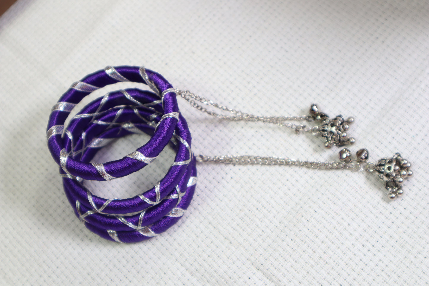 Kamule Navratri-Inspired Set of 4 Purple Silk Thread Bangles with Silver Criss-Cross Design & Hanging Beaded Tassels –Purple