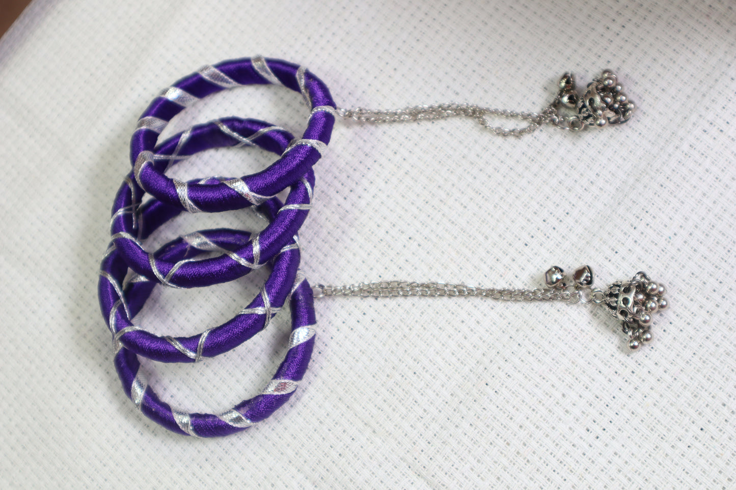 Kamule Navratri-Inspired Set of 4 Purple Silk Thread Bangles with Silver Criss-Cross Design & Hanging Beaded Tassels –Purple